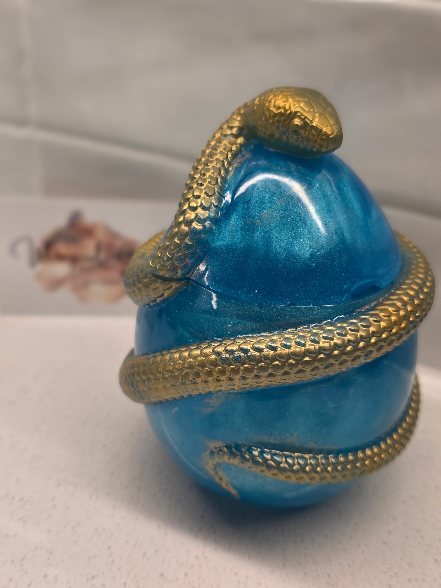 Snake protecting an Egg
